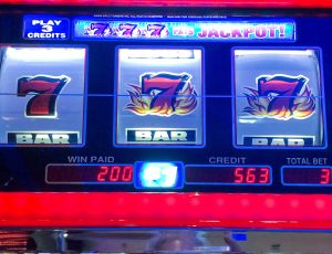 A slot machine with winning triple 7’s jackpot.
