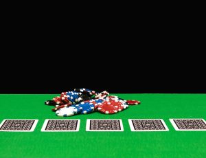 Poker chips on a gaming table in a casino Poker chips on a gaming table in a casino
